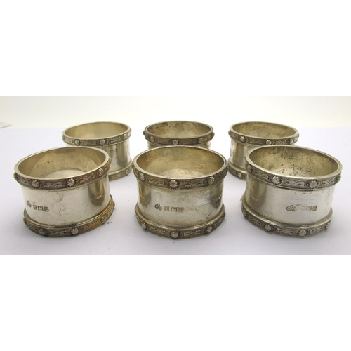 101 - A Set of Six Hallmarked Silver Napkin Rings, Elkington & Co, Birmingham 1964, each with Celtic band ... 