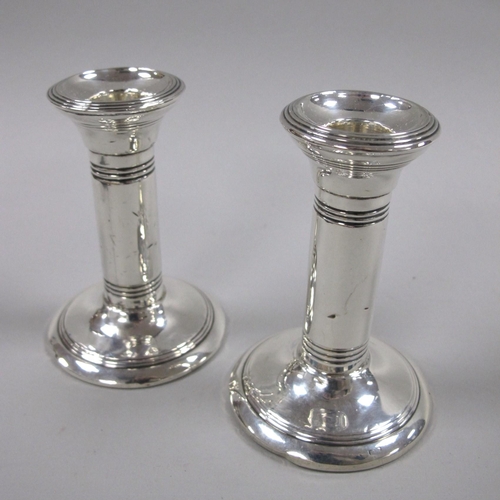 115 - A Pair of Hallmarked Silver Candlesticks, (marks rubbed) with reeded detail, 10cm high. (2)