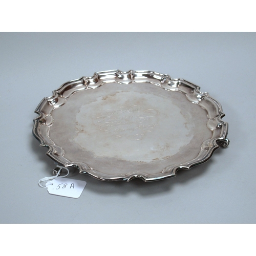 58A - A Hallmarked Silver Salver, FH, Birmingham 1972, of shaped circular form with engraved presentation ... 