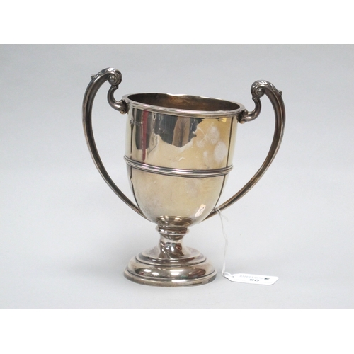 60 - A Hallmarked Silver Twin Handled Trophy Cup, B&FLtd, London 1922, of plain design with twin leaf cap... 