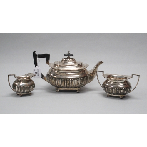 61 - A Hallmarked Silver Three Piece Tea Set, Walker & Hall, Sheffield 1930, each of semi gadrooned desig... 
