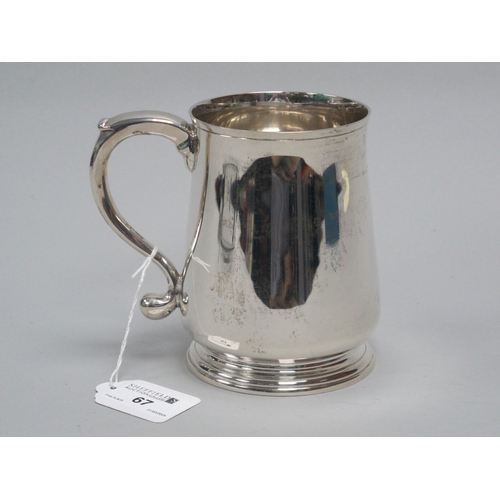 67 - A Hallmarked Silver Mug, RC, London 1962, of plain tapering form, with scroll handle, 12.2cm high (3... 