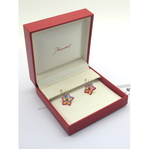 83 - Baccarat; A Pair of Modern Irridescent Orange Crystal Flowerhead Earrings, on hook fittings stamped ... 