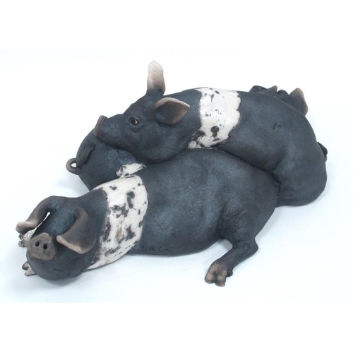 1061 - Lawson C. Rudge (b.1936) *ARR; A Raku Pottery Model of Three Piglets, signed, 43cm long, original re... 