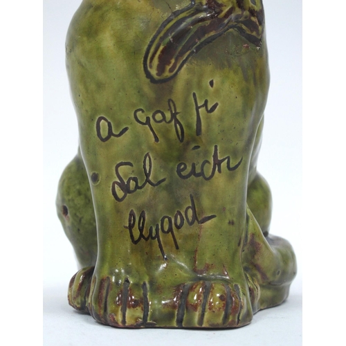 1082 - A Jones, Bridgend Pottery Green Glazed Model of a Cat, inscribed to the chest 