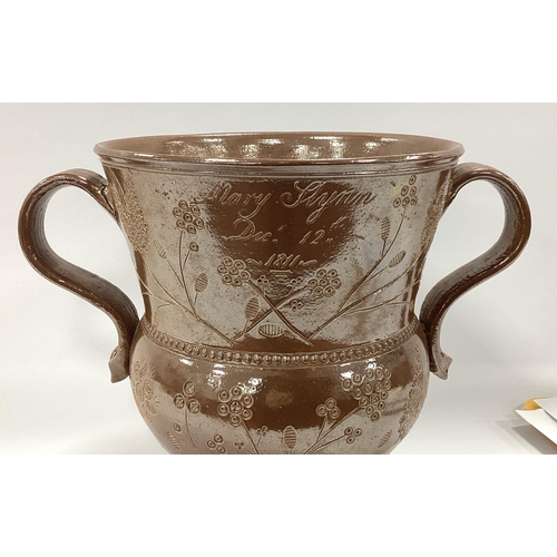 1084 - An Early XIX Century Salt-Glazed Stoneware Two-Handled Loving Cup, incised with floral decoration an... 