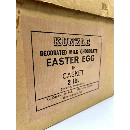 1262 - A Kunzle Decorated Milk Chocolate Easter Egg, in casket 2lb, circa mid XX Century, in original card ... 