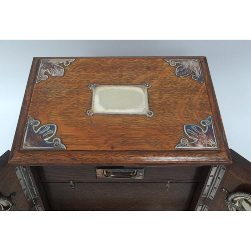 1266 - An Early XX Century Oak Cased Smokers Cabinet, of rectangular form with plated mounts and side carry... 