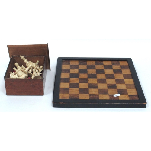 1282 - An Early XX Century Carved Bone Chess Set, with red stained and plain pieces, in box with board.