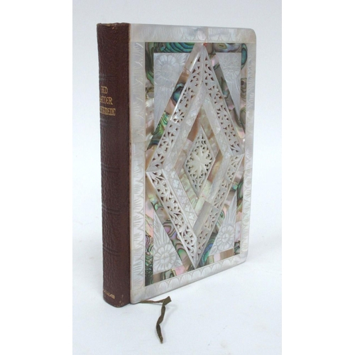 1313 - A Mother of Pearl Mounted 'Red Letter New Testament', elaborately pierced with flowers, inscribed an... 