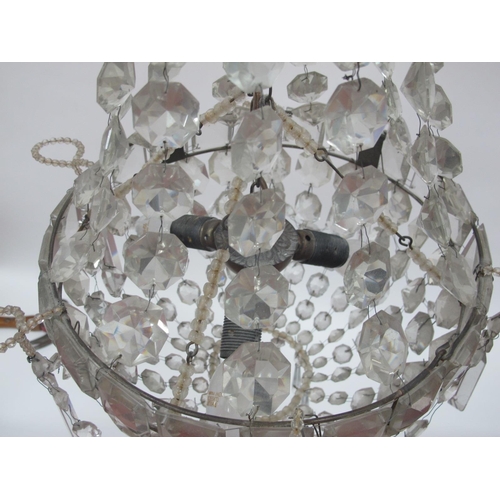 1330 - An Early/Mid XX Century 'Empire' Style Glass Chandelier, the facet cut top hung with prisms above a ... 