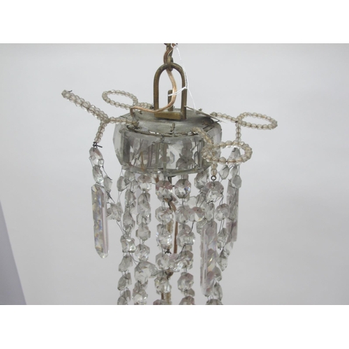 1330 - An Early/Mid XX Century 'Empire' Style Glass Chandelier, the facet cut top hung with prisms above a ... 