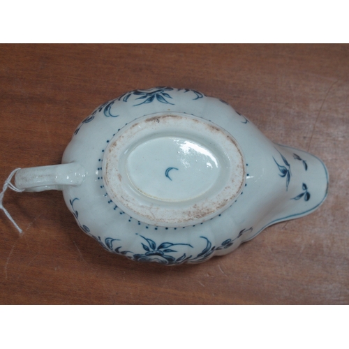 1045 - A Worcester Porcelain Sauce Boat, of fluted oval form, painted in underglaze blue with floral sprays... 