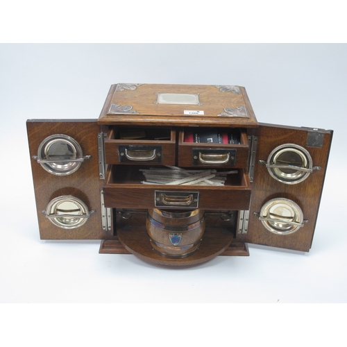 1266 - An Early XX Century Oak Cased Smokers Cabinet, of rectangular form with plated mounts and side carry... 