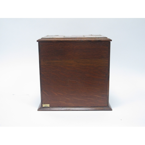 1266 - An Early XX Century Oak Cased Smokers Cabinet, of rectangular form with plated mounts and side carry... 