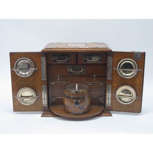 1266 - An Early XX Century Oak Cased Smokers Cabinet, of rectangular form with plated mounts and side carry... 