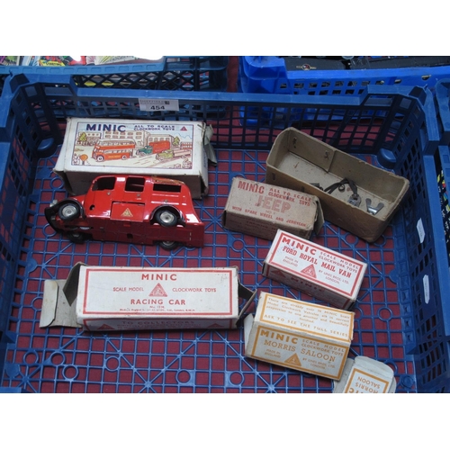 454 - A Quantity of Post Minic Clockwork Vehicles, including a plastic Royal Mail Van, boxed, a Fire Engin... 