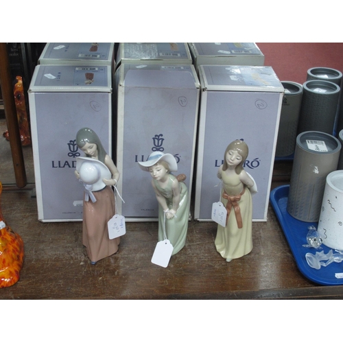 1289 - Lladro Pottery Figurines, 5009 (chipped) 5006 and 5007, with boxes 21.5cm high (3).