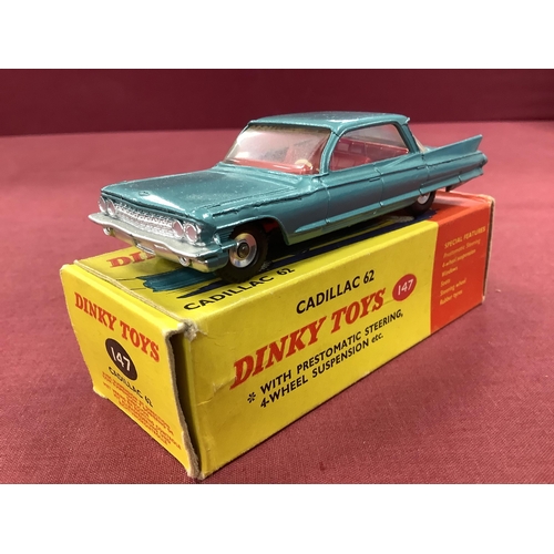 654 - Dinky Toys No 147 Cadillac 62 Metallic Type Green, overall very good/plus, boxed, rubbing/staining, ... 