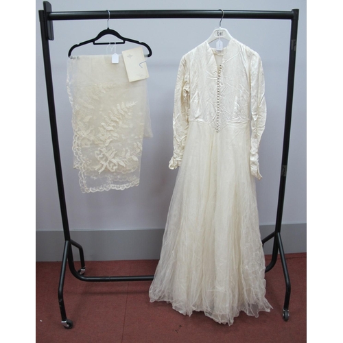 1005 - A Circa 1950'S Wedding Dress, the cream damask fitted bodice with centre front button fastening and ... 