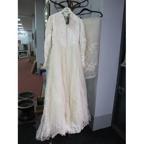 1005 - A Circa 1950'S Wedding Dress, the cream damask fitted bodice with centre front button fastening and ... 