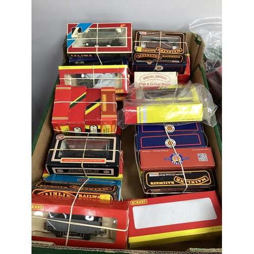 10 - OO gauge railway rolling stock and coaches by Hornby, Mainline, Lima etc., boxed, approx. 30