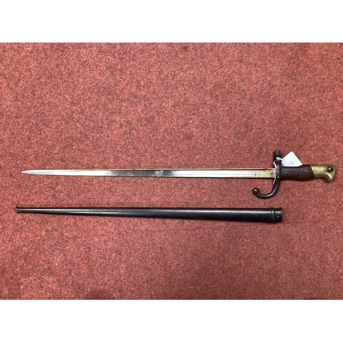 333 - XIX Century French Model 1874 Gras Bayonet and Scabbard, bayonet manufacturer mark 'Mre d'armes de S... 