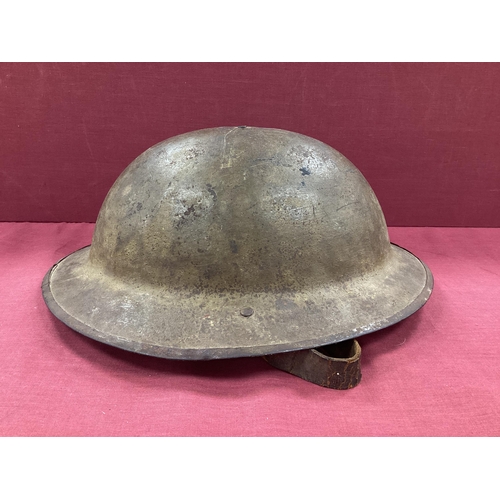 342 - WWI British Army Brodie Mk I steel helmet with part liner and leather strap, marks on the interior o... 