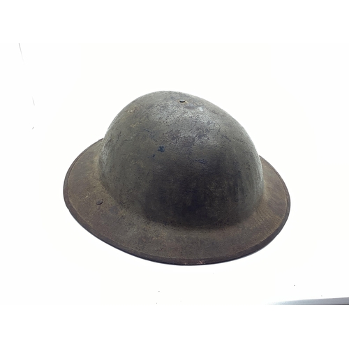 342 - WWI British Army Brodie Mk I steel helmet with part liner and leather strap, marks on the interior o... 