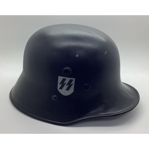 343 - WWII M16 transitional helmet with more recent paint/decals, plus, liner and chin strap. Marks on int... 