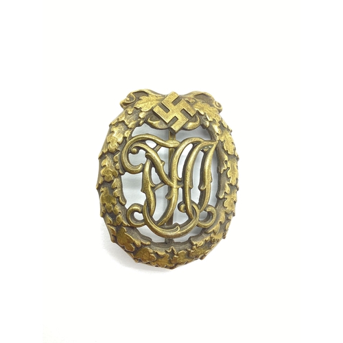 458 - WWII Third Reich German National Sports Badge in bronze, maker marks on reverse 'Wernstein Jena' and... 