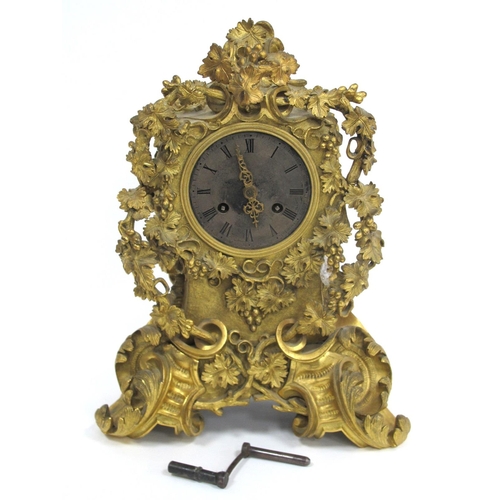 1011 - A Late XIX Century French Heavy Ormolu Mantle Clock, elaborately cast with fruiting vines and scroll... 