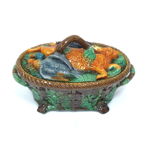 1111 - A Late XIX Century Majolica Game Pie Dish and Cover, of two handled oval footed form, the base mould... 