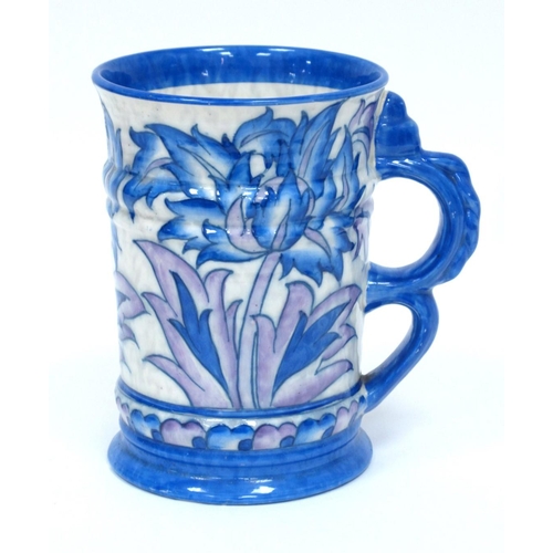 1123 - A Crown Ducal Charlotte Rhead Large Pottery Tankard, painted in a tubelined design of flowers and fo... 