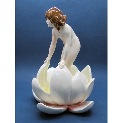 1162 - An Early XX Century Pottery Figure of a Nymph, standing in a lily pad, unmarked, 17.5cm high.