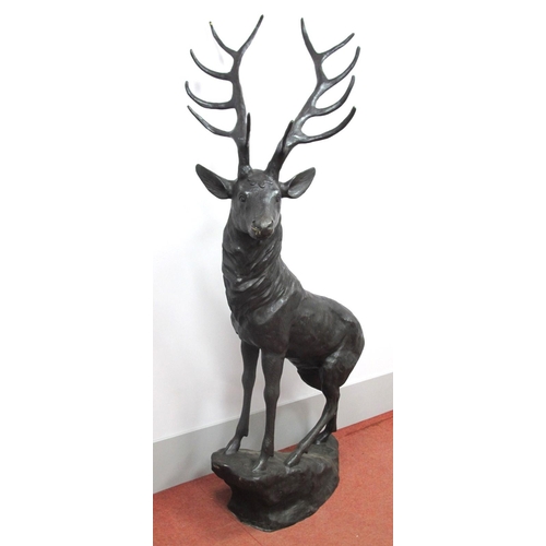 1261 - A XIX Century Style Hollow Bronzed Metal Figure of a Stag, on a naturalistic rocky base, 200cm high.