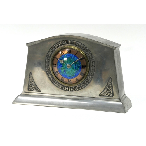 1285 - An English Pewter Mantle Clock, the circular dial with mottled blue enamel ground with copper chapte... 