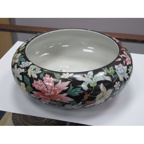 1193 - An Early XX Century Chinese Swallow Circular Bowl, decorated with colourful flowers against a black ... 