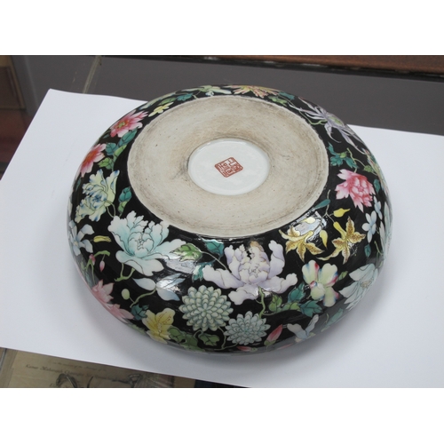 1193 - An Early XX Century Chinese Swallow Circular Bowl, decorated with colourful flowers against a black ... 