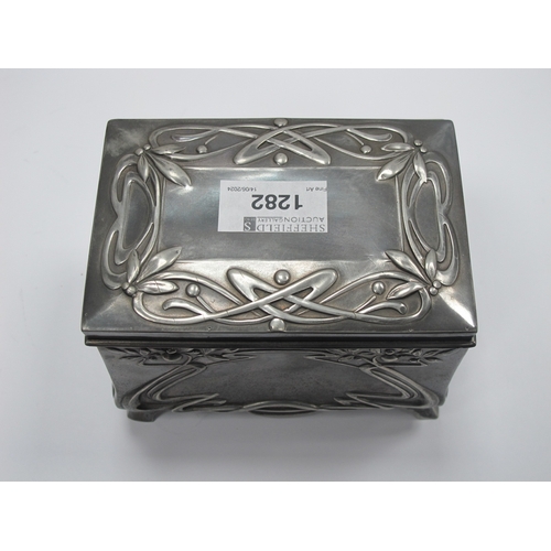 1282 - A Moritz Hacker Art Nouveau Pewter Trinket Box, of footed rectangular form with hinged lid, cast wit... 