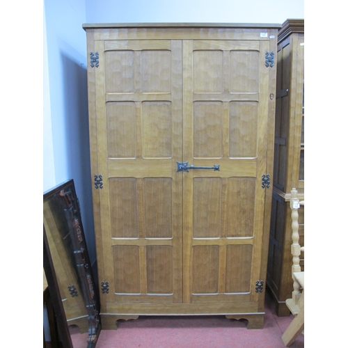 1528 - An Alan 'Acornman' Grainger Oak Wardrobe, with adzed panels, iron lock and butterfly hinges on brack... 