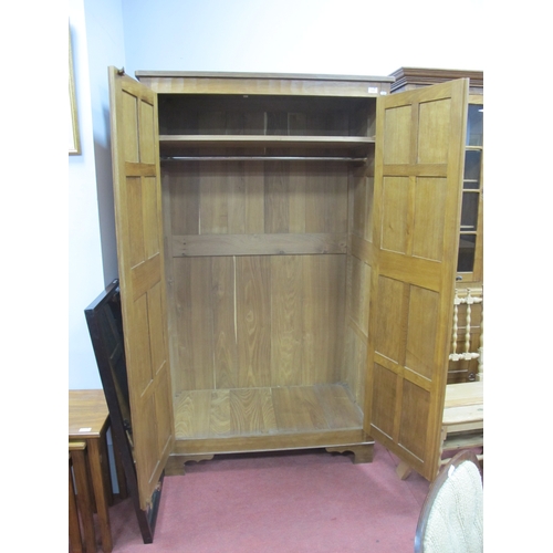 1528 - An Alan 'Acornman' Grainger Oak Wardrobe, with adzed panels, iron lock and butterfly hinges on brack... 