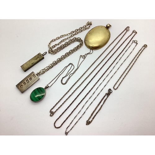 10 - A Hallmarked Silver Oval Collet Set Polished Hardstone Pendant, on fine chain, a feature hallmarked ... 