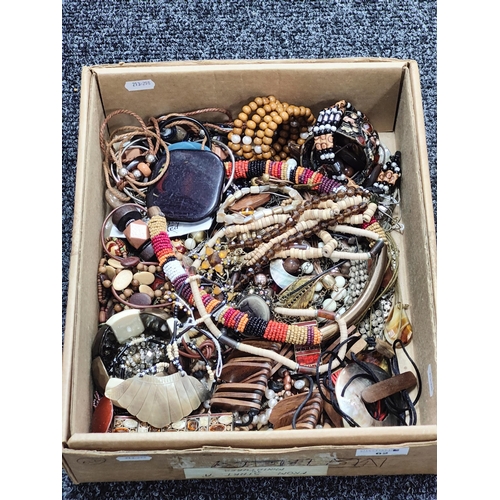 62 - An Assortment of Costume Jewellery, in hues of brown and gilt :- One Box