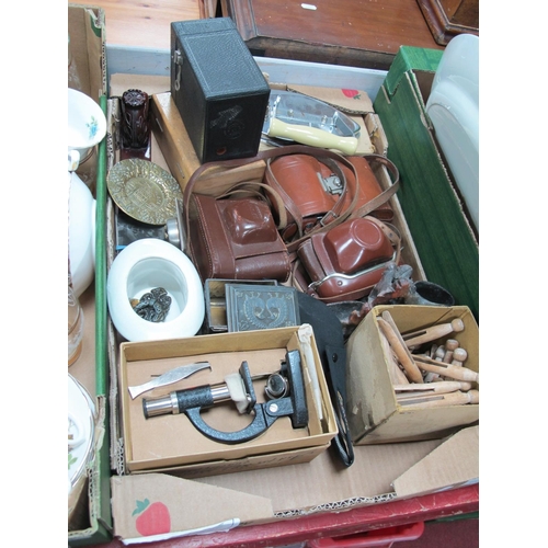 1070 - Camera's, boxed student's microscope, iron pegs, etc:- One Box