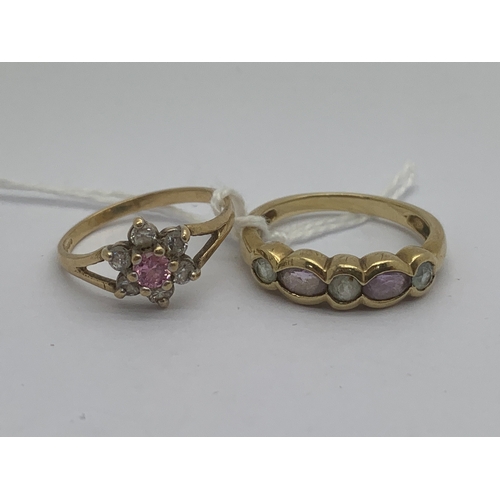 104 - A 9ct Gold Rubover Set Ring, the marquise and round cut stones alternately set to tapered shoulders ... 