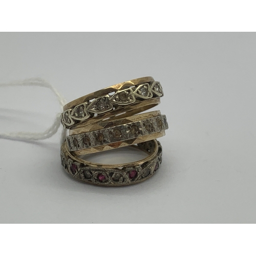 110 - Three Stone Set Eternity Bands, of decorative design. (3)