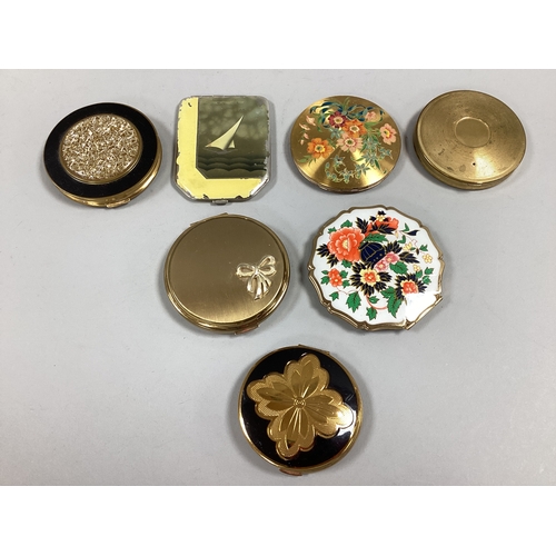 45 - An Assortment of Vintage and Later Gilt Tone Compacts, to include Stratton with bow decoration, Art ... 