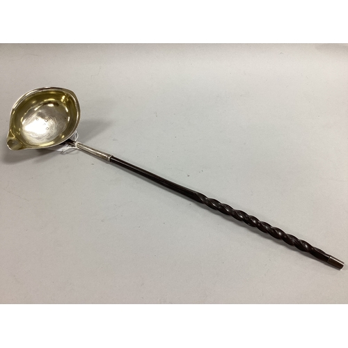 55 - A Georgian Hallmarked Silver Toddy Ladle, JS, London 1807, the oval bowl with side lip (previously g... 