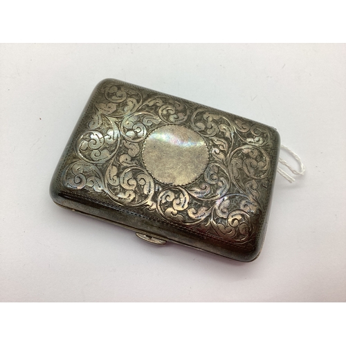 66 - A Hallmarked Silver Cigarette Case, Chester 1911, allover leaf scroll engraved (60grams).